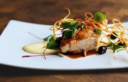 Roast chicken breast, potato purée and pine nuts
