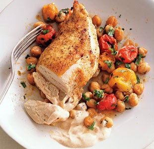 Roast chicken breasts with garbanzo beans, tomatoes, and paprika
