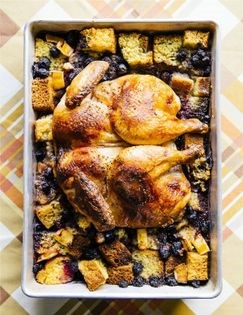 Roast chicken over blueberries, cornbread + lemon