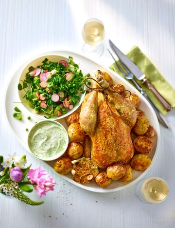 Roast chicken over new potatoes, dïll aioli and pea salad