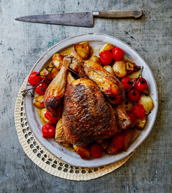 Roast chicken, roasties and black olive garlic butter