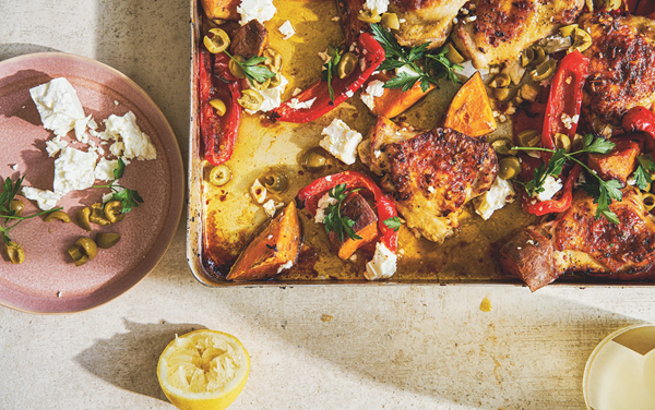 Roast chicken thighs with red peppers, sweet potatoes, green olives and feta