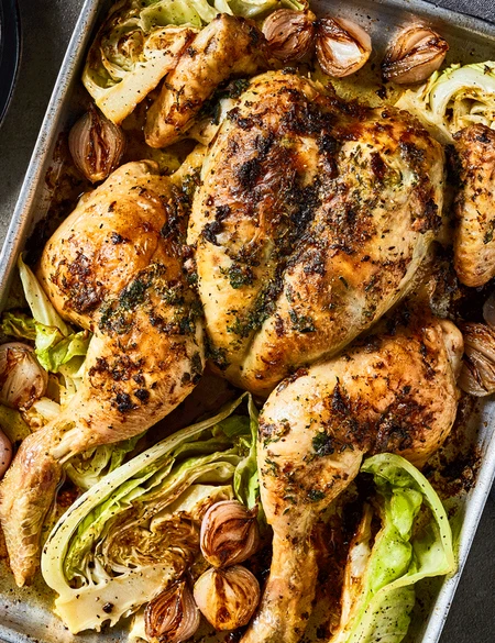 Roast chicken with anchovy butter, shallots and hispi cabbage