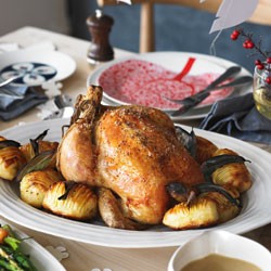 Roast chicken with fig and bacon stuffing and sherry gravy