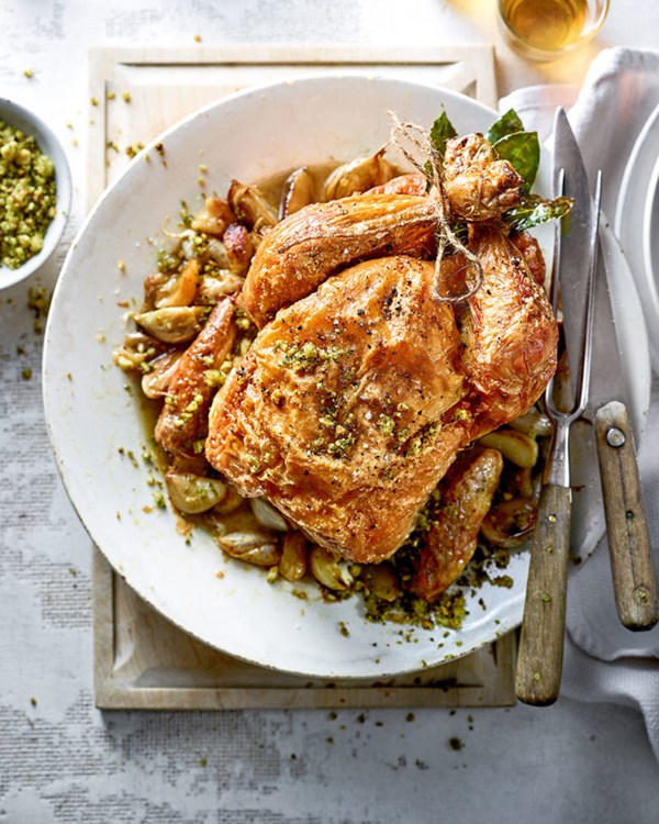 Roast chicken with golden garlic, sherry and almonds