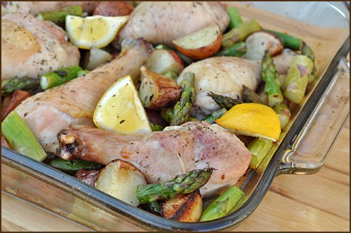 Roast chicken with potatoes, lemon and asparagus