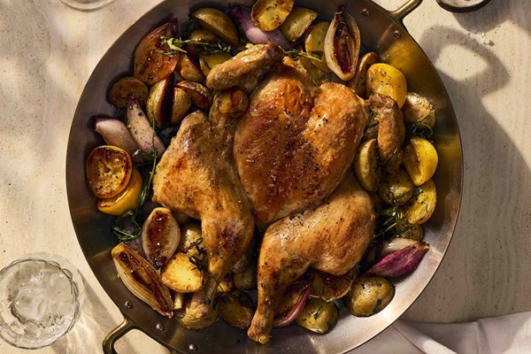 Roast chicken with potatoes, shallot, and lemon