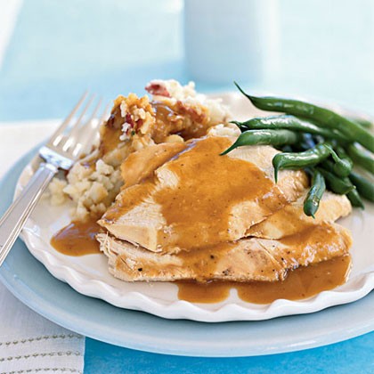 Roast chicken with smashed new potatoes and garlicy jus