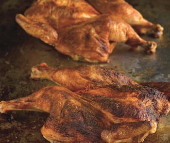Roast chicken with Spanish paprika and herb-roasted smashed potatoes