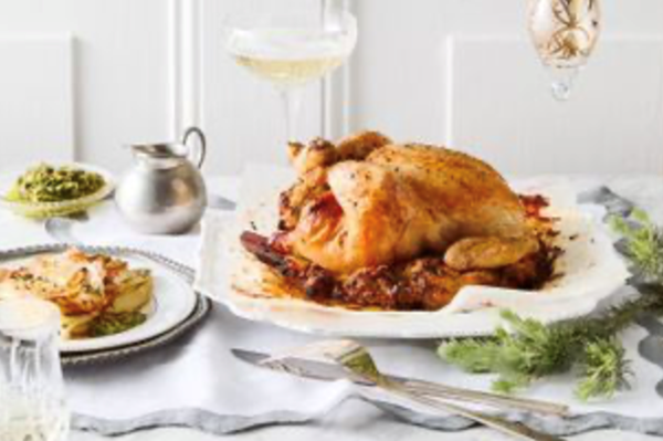 Roast chicken with stuffing, pommes boulangère and salsa verde