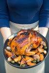 Roast chicken with tangerines, green olives, and silan