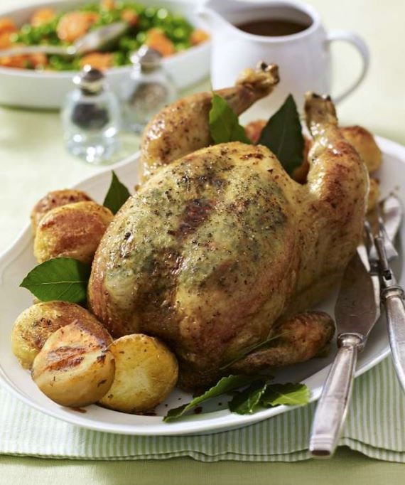 Roast chicken with tarragon butter and roast potatoes