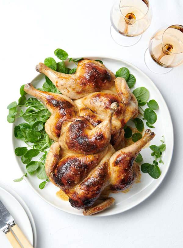 Roast chickens with fennel sausage and prune stuffing