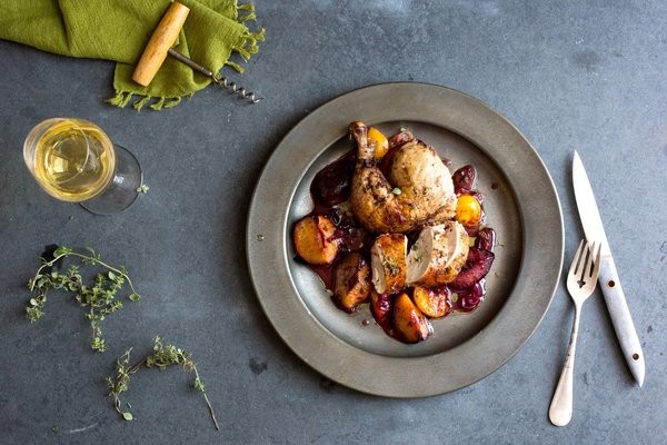 Roast chickens with plums