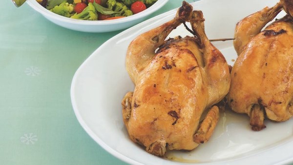 Roast chickens with sage, onion and sausage stuffing and porcini red wine sauce