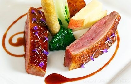Roast crown of duck with turnip, peach, duck croustillant and red wine jus