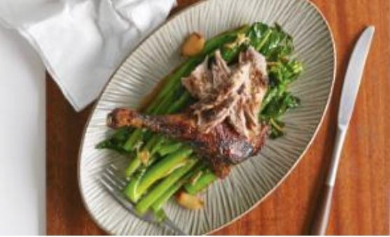 Roast duck basted in homemade five-spice and honey with ginger and garlic gai lan