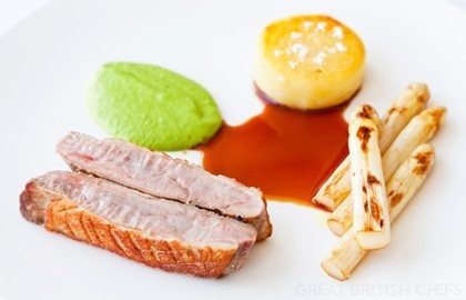 Roast duck breast with white asparagus, pea cream and Meantime beer gravy