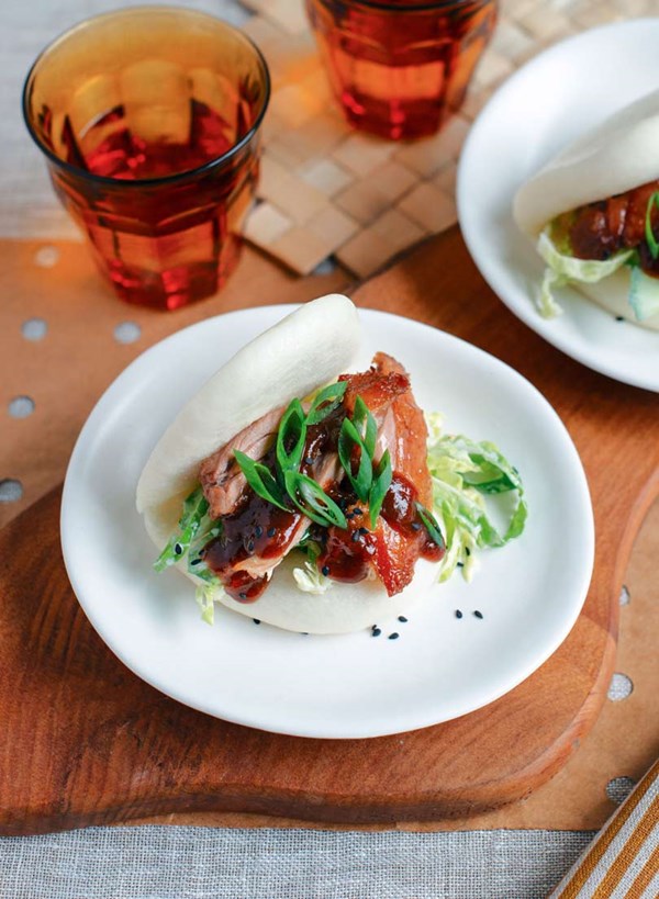 Roast duck burger with hoisin sauce in steamed white bun