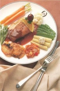 Roast duck served with plum puree and rich onion and sage sauce [John Tovey]