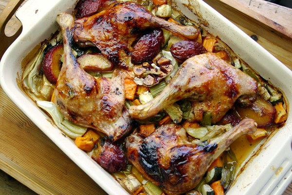 Roast duck with plums, garlic and sweet potato