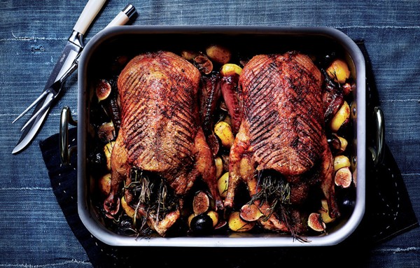Roast duck with potatoes, figs, and rosemary