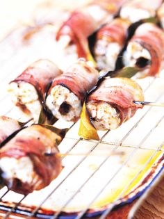 Roast eels with pancetta and bay leaves (Anguilla alla spiedo)