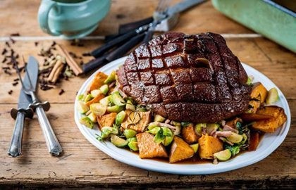 Roast gammon with sweet potato roasties and bacon sprouts