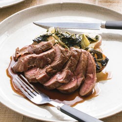 Roast garlic and anchovy lamb rumps with potato and silverbeet gratin