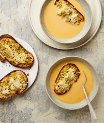 Roast garlic soup with Manchego and olive toast