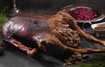 Roast goose with chestnut and pear stuffing and braised red cabbage