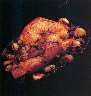 Roast guinea fowl with black olive butter sauce