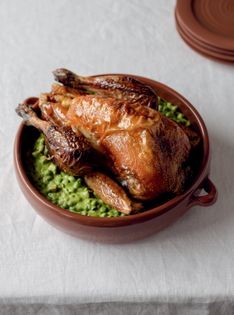 Roast guinea fowl with peas and bacon