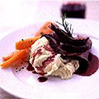 Roast haunch of venison with a red wine gravy