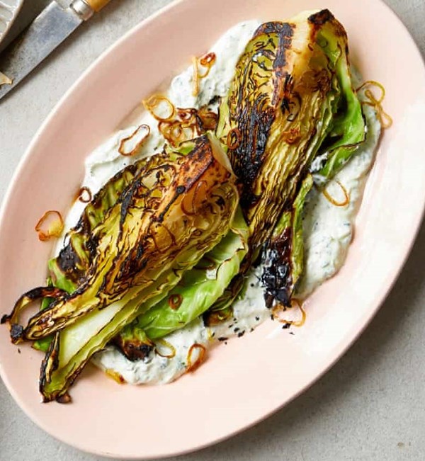 Roast hispi with herb yoghurt and crisp shallots