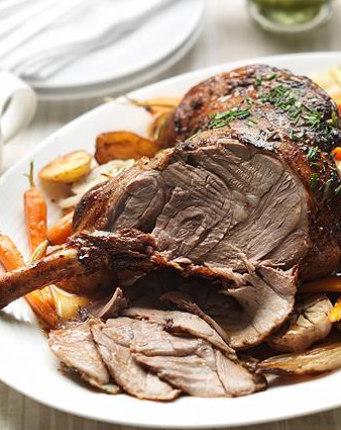 Roast lamb with spring vegetables and mint and caper sauce
