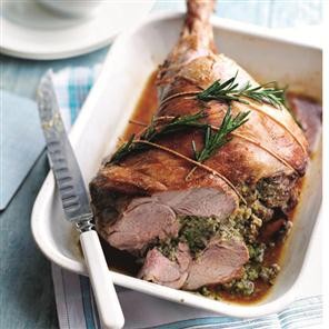 Roast leg of lamb stuffed with herbs, macadamia nuts and lemon