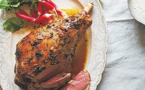 Roast leg of lamb stuffed with lemon and  herbs