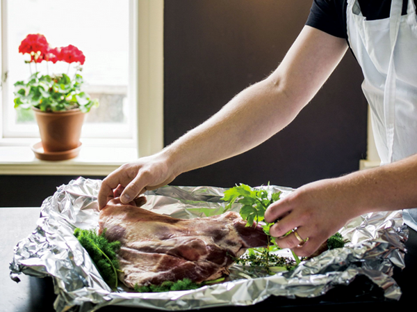Roast leg of lamb with herbs and kale
