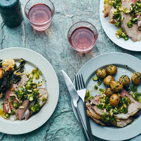 Roast leg of lamb with potatoes and asparagus gremolata