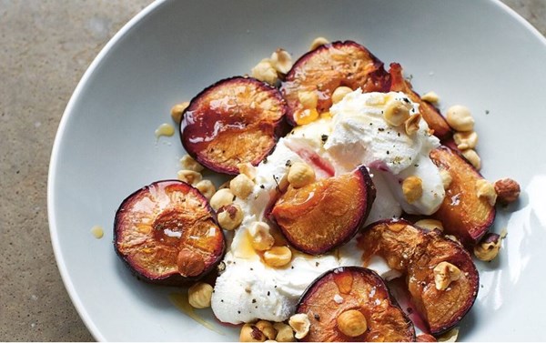 Roast plums, goat's labneh, toasted hazelnuts and honey