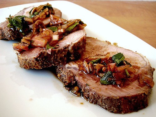 Roast pork loin with grilled peaches and wildflower honey vinaigrette