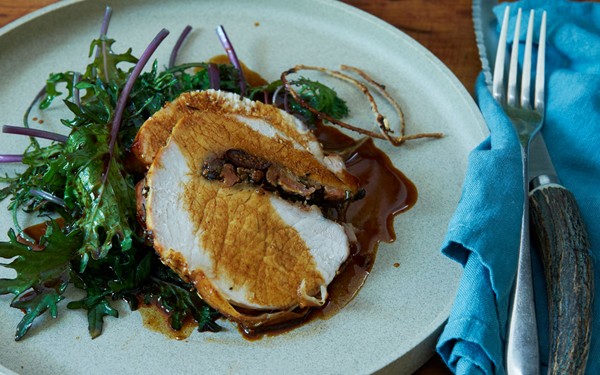 Roast pork loin with sausage, figs, and fresh herbs
