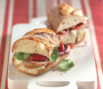 Roast pork sandwiches with sweet peppers and arugula