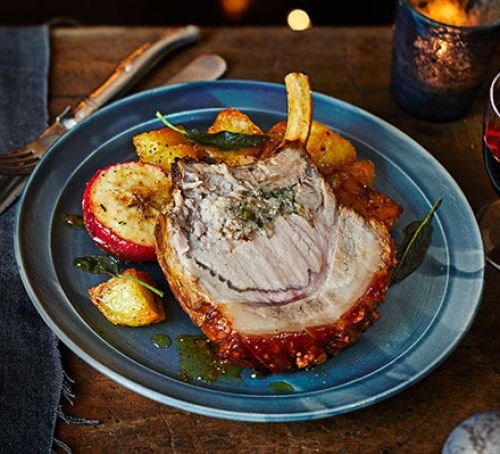 Roast pork with sage & double onion stuffing, baked apples & roasties