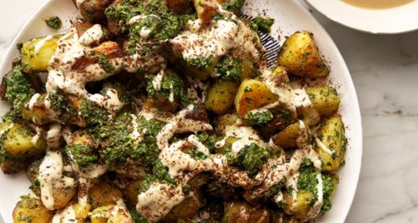 Roast potatoes with green sauce and tahini