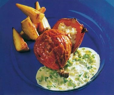 Roast pumpkin with lemon-hazelnut risotto stuffing, leek and Parmesan sauce, and roast parsnips and sweetcorn