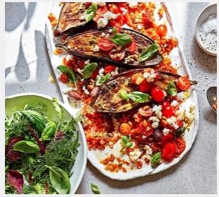 Roast puttanesca aubergines with tomato rice and feta