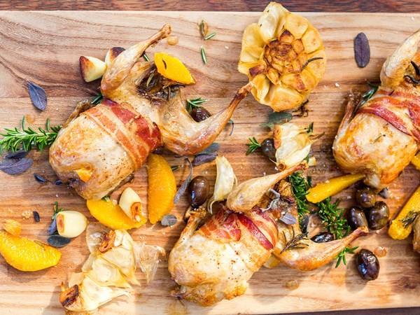 Roast quail with pancetta, olives & lemon