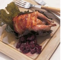 Roast quail wrapped in pancetta and vine leaves with grape confit
